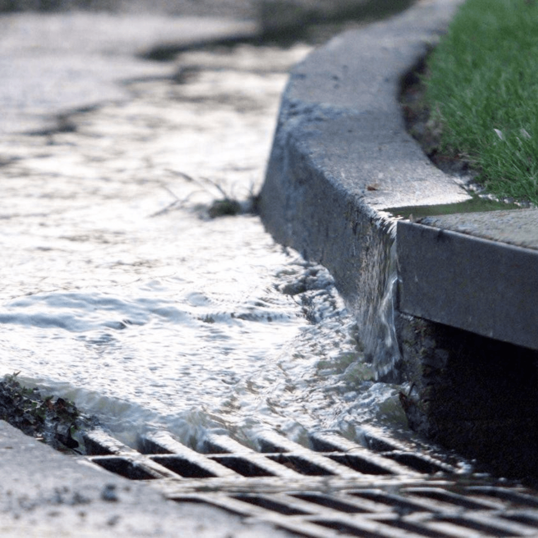 Water drains into a storm drain